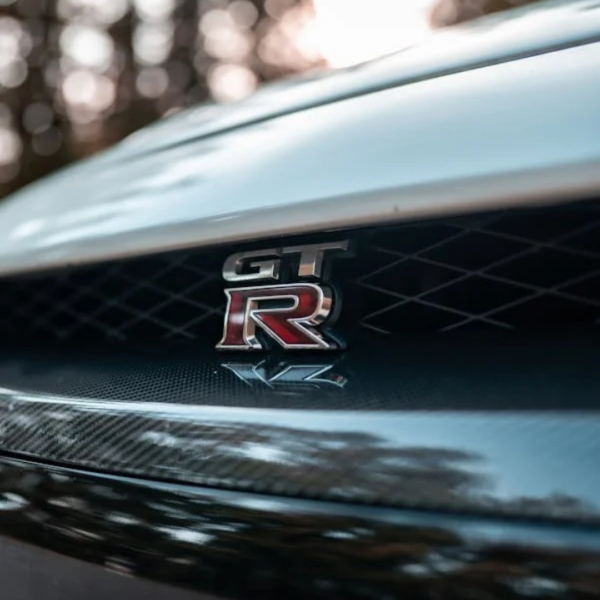 High-quality chrome Nissan GT-R emblem, designed for enhanced vehicle aesthetics and durability in Qatar