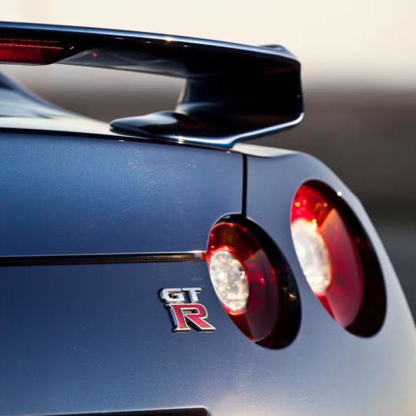 High-quality chrome Nissan GT-R emblem, designed for enhanced vehicle aesthetics and durability in Qatar
